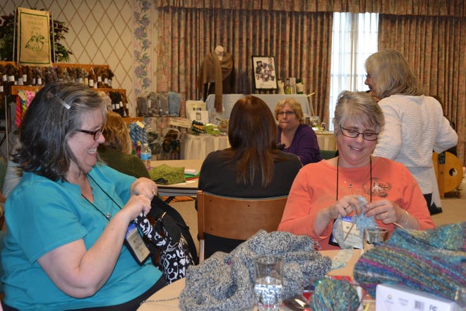 Participants in the 2016 knitters retreat share stories, while enjoying their craft. COURTESY PHOTO