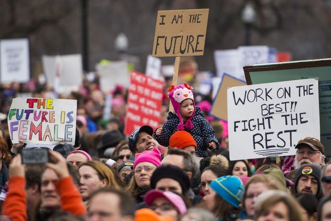 Demonstrators look on during presentations at the Boston Women's March for America on Boston Common, Jan. 21, 2017. (Wicked Local Photo/Adam Glanzman)