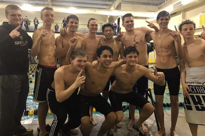 The Shelby High boys swim team celebrates after winning the South Mountain Athletic Conference championship. Kings Mountain took the girls league crown. SPECIAL TO THE STAR
