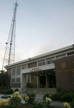 This photo taken June 11, 2014 shows a communications tower behind the Tallahassee Police Department in Tallahassee, Fla. The department has used the "Stingray" surveillance device, which masquerades as a cell phone tower, to intercept mobile phone calls.