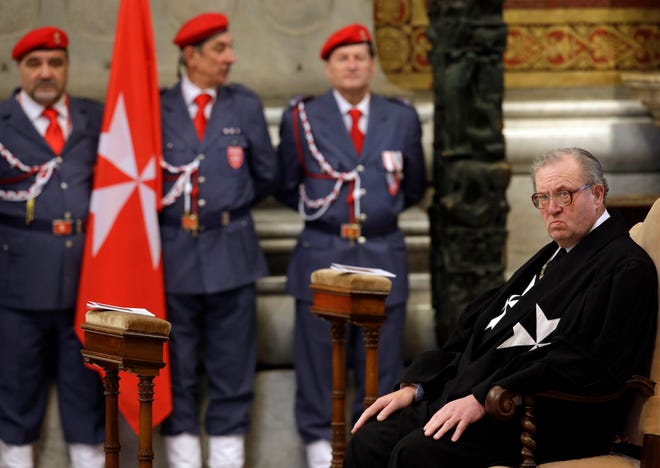 FILE - In this Feb. 9, 2013 file photo, Grand Master of the Knights of Malta Matthew Festing waits for the start of a Mass celebrated by Cardinal Tacisio Bertone, not pictured, to mark the 900th anniversary of the Order of the Knights of Malta, at the Vatican. Festing resigned after entering into a public spat with Pope Francis over the ouster of a top official involved in a condom scandal, a spokeswoman for the ancient lay Catholic order said on Wednesday, Jan. 25, 2017. (AP Photo/Gregorio Borgia, File)