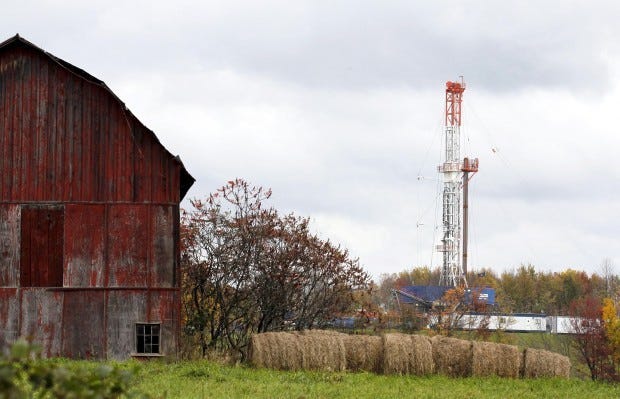 A drilling rig is set up near a barn in Springville, Pa., to tap gas from the giant Marcellus shale gas field.