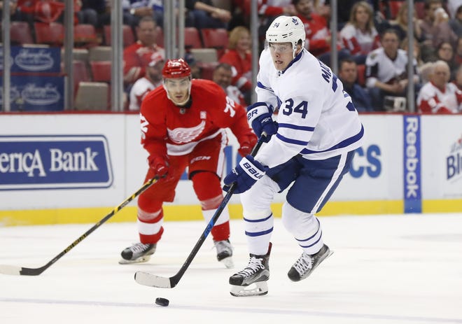 Toronto Maple Leafs center Auston Matthews (34) carries the puck against the Detroit Red Wings in the first period of an NHL hockey game Wednesday, Jan. 25, 2017, in Detroit. (AP Photo/Paul Sancya)