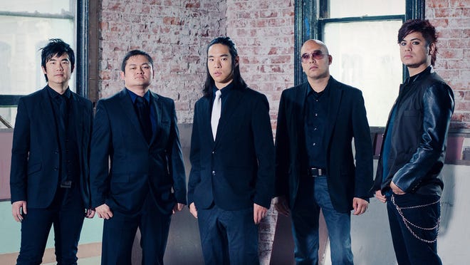 The members of the Asian-American rock band The Slants