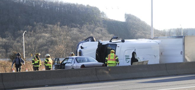 State police and rescuers work at the scene of a tractor trailer rollover on Interstate 80 East near the Marshalls Creek interchange on Wednesday afternoon before 3:45 p.m. January 25, 2017. Traffic was backed up for a time. The truck blocked one lane. (Keith R. Stevenson/Pocono Record)