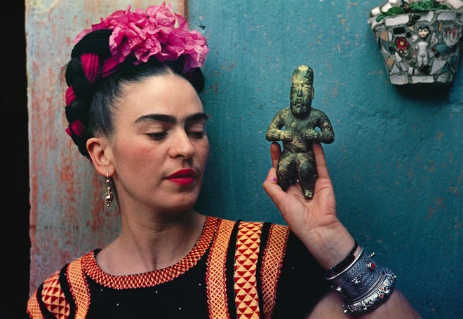 "Frida with Olmeca Figurine, Coyoacán" was taken in 1939 and is a carbon process print now on display at the Appleton Museum of Art in Ocala as part of the exhibit “Frida Kahlo: Through the Lens of Nickolas Muray.” Courtesy of the Appleton Museum of Art