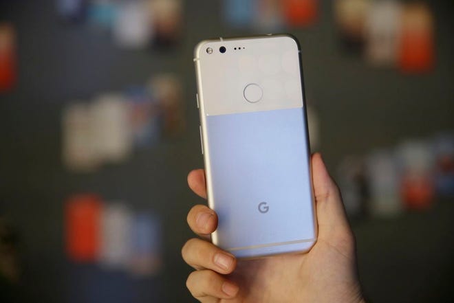 The new Google Pixel phone is displayed following a product event, in San Francisco. Google's head-on rival to the iPhone, the Pixel, is off to a modest but promising start. It is Google's first step in what it says will be a years-long effort to take on Apple where it's strongest. (AP Photo/Eric Risberg, File)