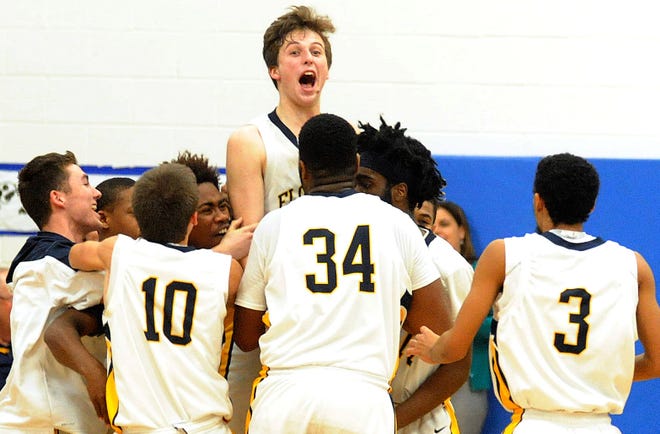 Florence's Kyle Ryan (33) celebrates with his team after scoring the game winning shot at the buzzer against Moorestown Friends School at Florence Township Memorial High School on Friday, Jan. 27, 2017.