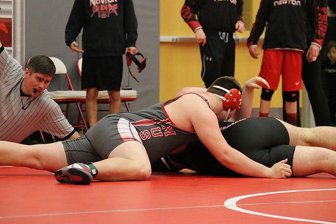 Jacob Comer pins his Newton opponent during the DC-G multi dual on Jan. 26. Comer won both of his matches by fall.