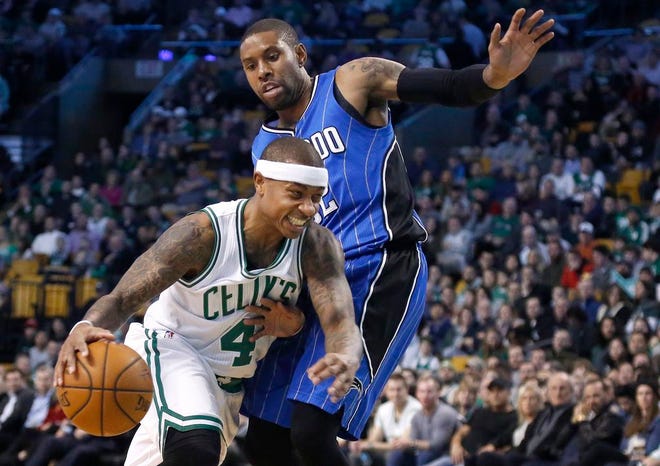 Orlando Magic guard C.J. Watson tries to keep Boston Celtics guard Isaiah Thomas from driving to the basket during the first half of an NBA basketball game, Friday, Jan. 27, 2017, in Boston.