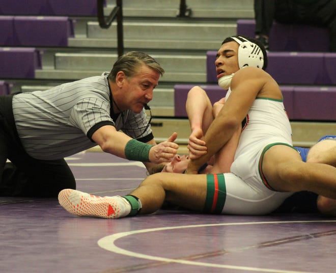 LCHS freshman Bryan Garza pins Dylan Sylvenus of Auburn in the 160 weight class Thursday night at Lincoln College. Photo by Jean Ann Miller/The Courier