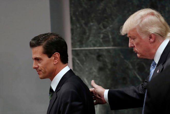 President Donald Trump and Mexican President Enrique Pena Nieto spoke for an hour by phone Friday Jan. 27, 2017 amid rising tensions over the U.S. leader's plans for a southern border wall, administration officials said. (AP Photo/Dario Lopez-Mills)