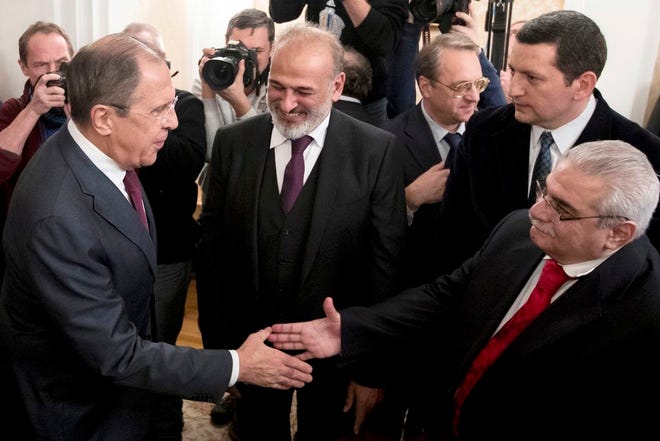 Russian Foreign Minister Sergey Lavrov said at the start of Friday's meeting that the negotiations previously set for Feb. 8 have been postponed until the end of the month. (AP Photo/Pavel Golovkin)