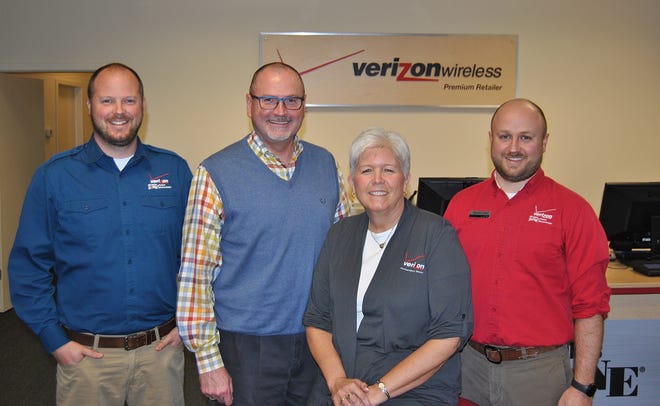 From left: Matt Bartlett, Darryl Bartlett, Becky Bartlett, and Matthew Neal all serve vital roles in running four Wireless Zone stores around West Michigan. Austin Metz/Sentinel Staff