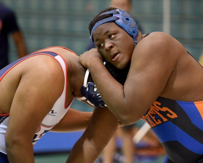 Bartow's Rashard Henry (right) wrestles Darrell Lowe of Freedom High School in the 285-ound weight class on Saturday at George Jenkins High School. Henry took sixth place after Lowe piinned him. SCOTT WHEELER/THE LEDGER