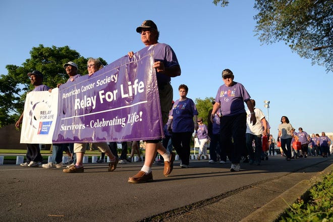Cancer survivors lead off the Lenoir County Relay For Life, Friday, at Lenoir Community College in 2016.