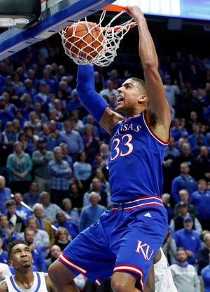 Kansas forward Landen Lucas dunks during the second half of Saturday night’s game against Kentucky at Rupp Arena in Lexington, Ky. Lucas scored 13 points and pulled in five rebounds in the No. 2 Jayhawks’ 79-73 victory over the No. 4 Wildcats. (The Associated Press)