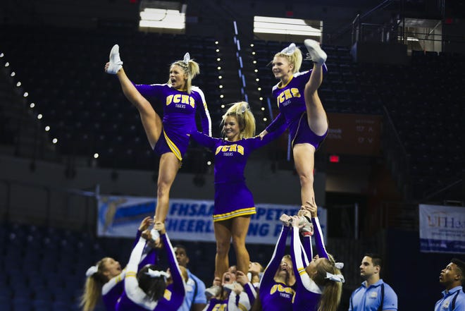Union County High School cheerleaders compete in the semifinals of the Florida High School Competitive Cheerleading State Championships at the Stephen C. O'Connell Center Sunday. (Andrea Cornejo/Staff photographer)