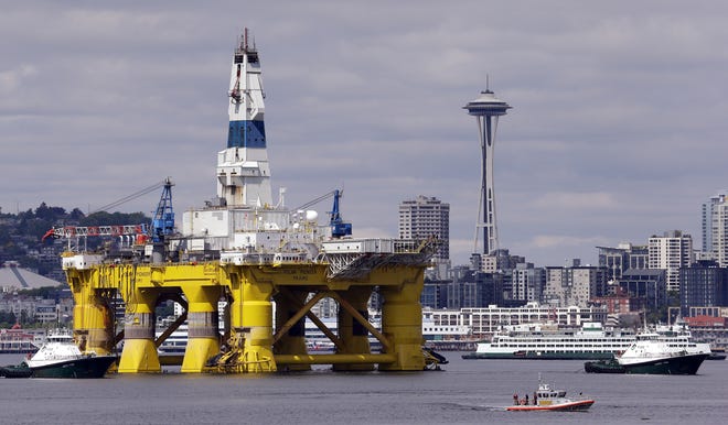The oil drilling rig Polar Pioneer is towed toward a dock in Elliott Bay in Seattle in 2015. Jobs in the offshore oil industry are becoming more scarce as robotics continue to improve. AP FILE