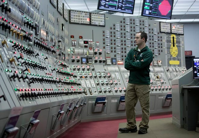 In this November photo, reactor operator Patrick Ryan works in the Unit 1 control room at Nine Mile Point nuclear power plant in Oswego, N.Y. (AP Photo/Mike Groll)