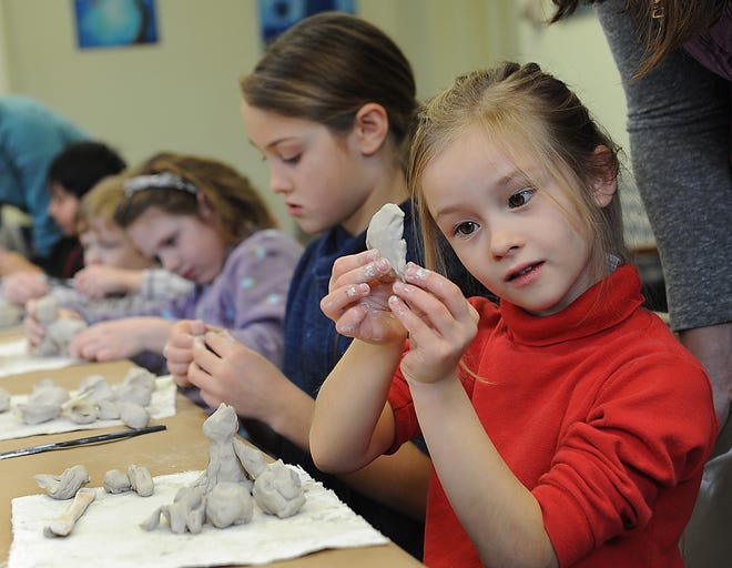 MAKING MEMORIES

Gwyneth Robertson Dubois, 5, works on a clay figure during a Museum of Fine Arts Fantastical Creatures art program at the Southborough Public Library Saturday. (Daily News and Wicked Local Staff Photo/Ken McGagh)