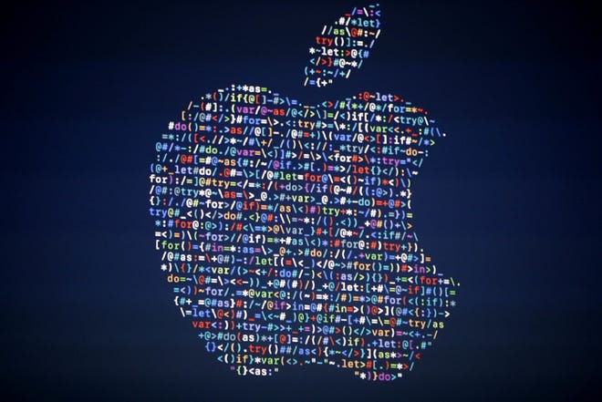 In this June 13, 2016 file photo, The Apple logo is shown on a screen at the Apple Worldwide Developers Conference in the Bill Graham Civic Auditorium, in San Francisco. Google, Apple and other tech giants expressed dismay over an executive order on immigration from President Donald Trump that bars nationals of seven Muslim-majority countries from entering the U.S. The U.S tech industry relies on foreign engineers and other technical experts for a sizeable percentage of its workforce. The order bars entry to the U.S. for anyone from Iran, Iraq, Libya, Somalia, Sudan, Syria and Yemen for 90 days. AP