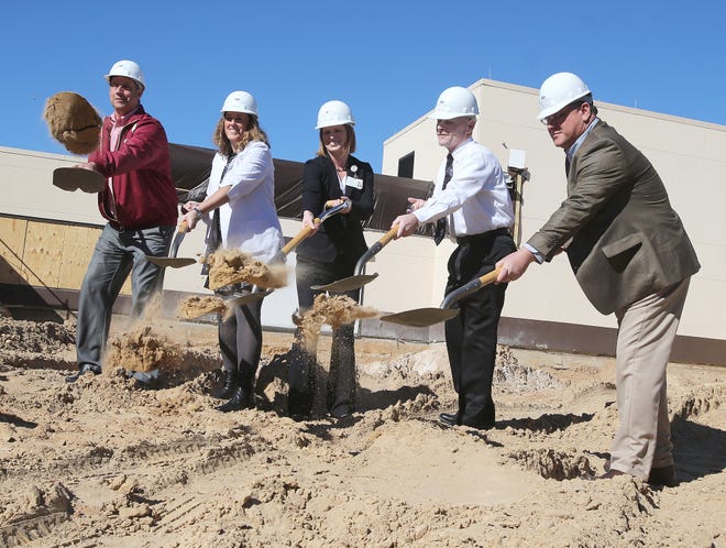 From left, County Commissioner Bill Dozier and Gulf Coast Regional Medical Center Chief Nursing Officer Mary Reval, Chief Operating Officer Holly Jackson, Director of Emergency and Hospitalist for Emcare Dr. Tackett, and Board of Trustees member Jorge Gonzales ceremoniously break ground Monday for the ER expansion at Gulf Coast Regional Medical Center in Panama City. ANDREW WARDLOW/THE NEWS HERALD