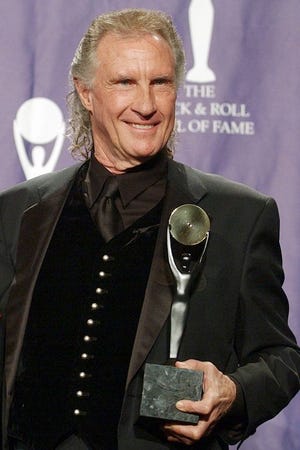In this March 10, 2003 photo, Bill Medley poses for photographers after being inducted into the Rock and Roll Hall of Fame in New York. Officials are expected to release additional information on Monday, Jan. 30, about how they solved the 1976 rape and killing of Medley's ex-wife Karen Klaas.(AP Photo/Ed Betz, File)