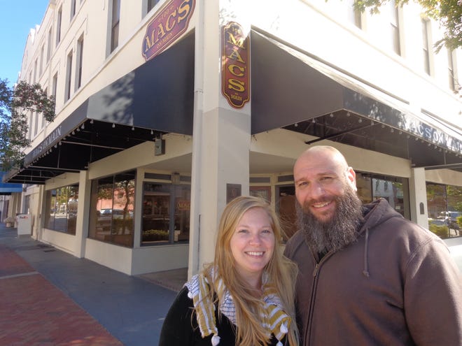 Melisa and Dan Reed in front of the former location of Mac's on Main, where the couple will open their new restaurant called The Table. News-Journal/Austin Fuller
