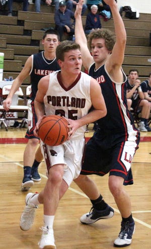 Portland's Brett Patrick drives into the lane against Lakewood Tuesday night. (Photo by Connor Ryan / Ionia Sentinel-Standard)