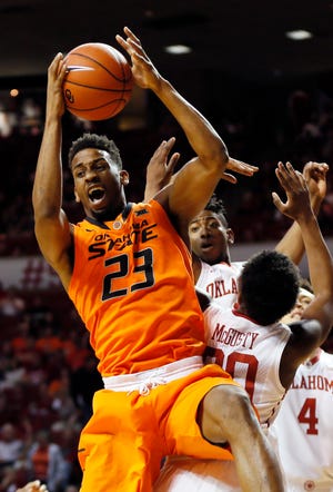 Oklahoma State's Leyton Hammonds grabs a rebound Jan. 30 during the Bedlam game with the Oklahoma Sooners in Norman. [Photo by Nate Billings, The Oklahoman]
