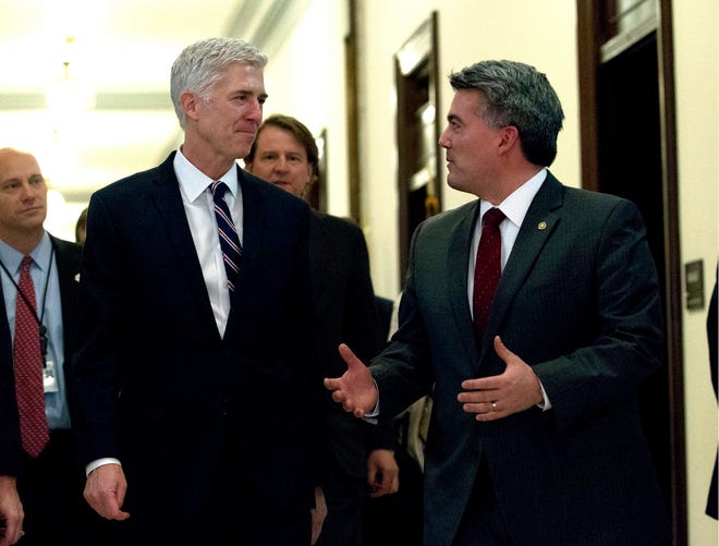 Supreme Court Justice nominee Neil Gorsuch, left, meets with Sen. Cory Gardner, R-Colo. on Capitol Hill in Washington, Wednesday, Feb. 1, 2017. (AP Photo/Jose Luis Magana)