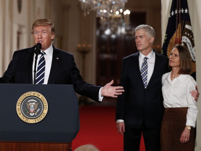 President Donald Trump speaks in the East Room of the White House in Washington, Tuesday, Jan. 31, 2017, to announce Judge Neil Gorsuch as his nominee for the Supreme Court. Gorsuch stands with his wife Louise. (AP Photo/Carolyn Kaster)