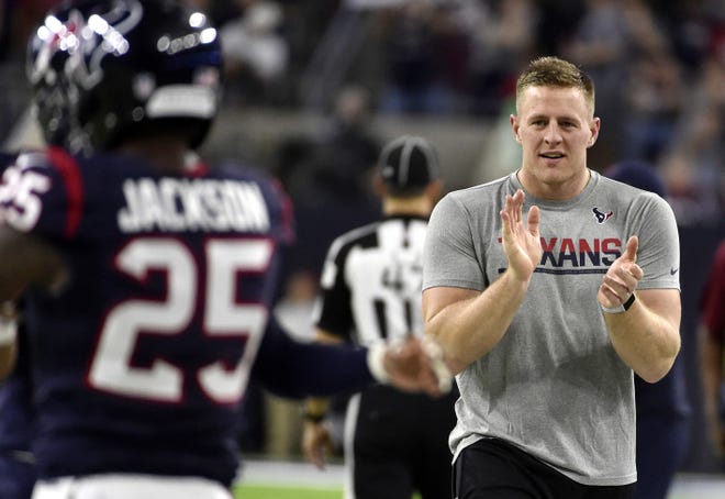 Houston Texans J.J. Watt, right, encourages teammates during the first half of a game against the Cincinnati Bengals on Dec. 24, 2016, in Houston. Watt is healthy after missing most of the season following back surgery, and the Houston Texans star is eager to show that he can be even better than he was before. (AP Photo/Eric Christian Smith, File)