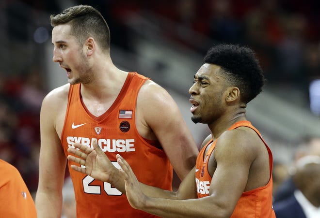 Syracuse's Tyler Lydon, left, and John Gillon react during the second half of an NCAA college basketball game against North Carolina State in Raleigh, N.C. on Wednesday. AP Photo/Gerry Broome