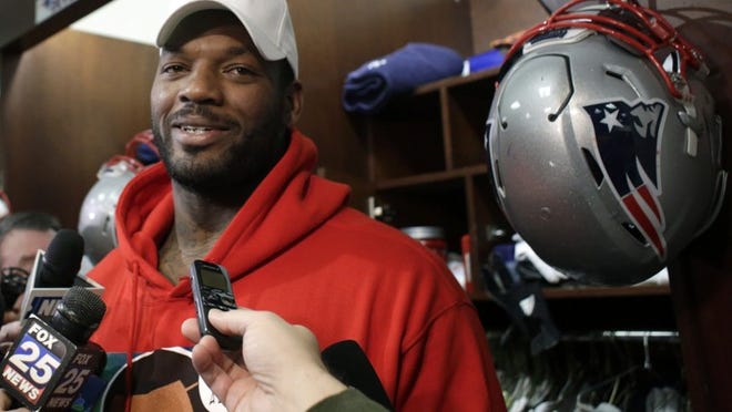 New England Patriots tight end Martellus Bennett, speaking with reporters after practice Jan. 19, is a 29-year-old free spirit who has called himself “the black Dr. Seuss” and “Martysaurus.” (AP Photo/Steven Senne)