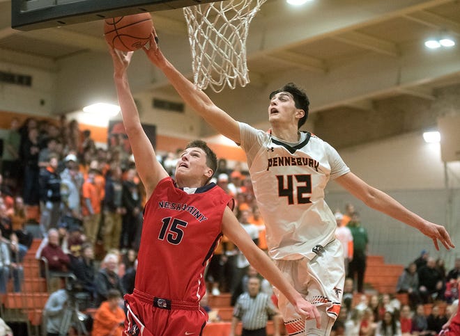 Pennsbury's Mark Flagg (42) draws a foul as he defends against Neshaminy's Chris Arcidiacono (15) in the third period of a basketball game Thursday, Dec. 22, 2016, in Falls.