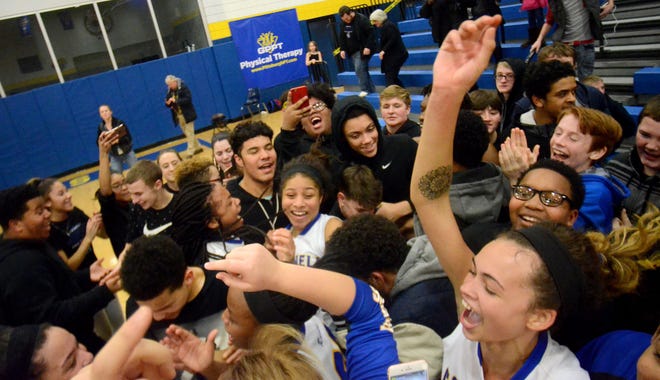 Cornell players and fans celebrate after the win over Quigley Thursday at Cornell High School.