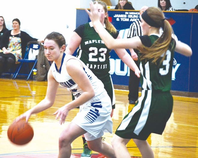 Mackinaw City sophomore Samantha Somers (left) looks to score a bucket against Maplewood Baptist's Liberty Bailey during the fourth quarter of a game on Thursday.