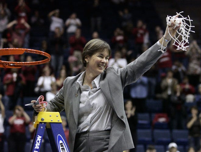 Stanford coach Tara VanDerveer cuts down the net after Stanford defeated Iowa State 74-53 to advance to the Final Four during a women's NCAA tournament regional championship in 2009 in Berkeley, Calif. On Friday night when No. 8 Stanford hosts USC, Vanderveer is poised to become just the second NCAA women's coach to enter the 1,000 wins club, alongside the late Pat Summitt. (AP Photo/Marcio Jose Sanchez, File)