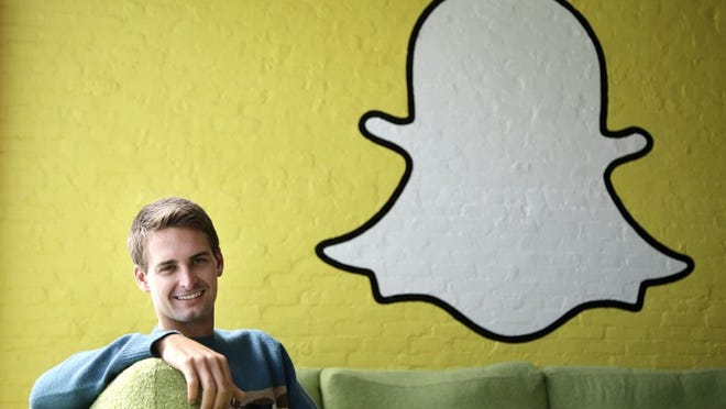 FILE - In this Thursday, Oct. 24, 2013, file photo, Snapchat CEO Evan Spiegel poses for a photo in Los Angeles. Snap Inc., owner of the ephemeral message service Snapchat, seeks to raise up to $3 billion in an initial public offering. According to IPO documents filed on Thursday, Feb. 2, 2017, Snap has lost nearly $1 billion in the past two years. (AP Photo/Jae C. Hong, File)