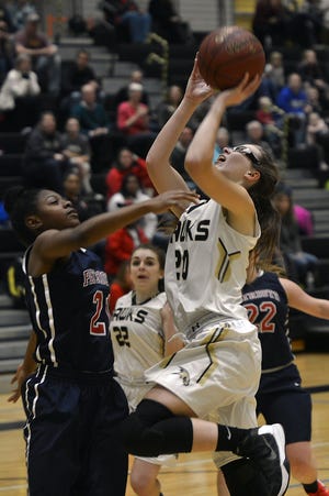 Corning player Molly Behan goes up strong against Binghamton Friday in Corning. Eric Wensel/The Leader