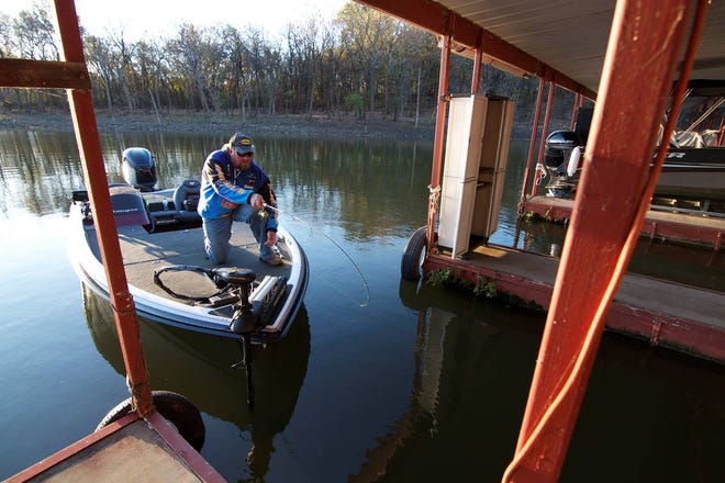An angler uses the "dock shooting" casting technique on Fort Gibson Lake. [PHOTO PROVIDED]