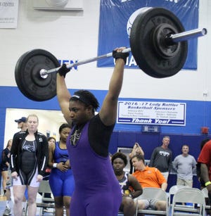 Booker High's Christian McKay competes in the clean and jerk at the Class 1A State Girls Weightlifting Meet on Friday afternoon at Belleview High School. McKay finished second in the 199-pound weight class. HERALD-TRIBUNE STAFF PHOTO / DENNIS MAFFEZZOLI