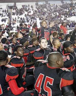 The New Bern Bears celebrate their 39-38 win over Porter Ridge in the 2012 NCHSAA 4-A state championship game.