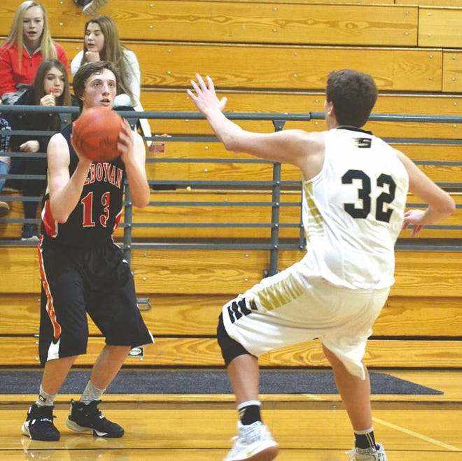 Cheboygan junior Max Klinger (left) gets ready to fire a three-pointer during a game against St. Ignace on Jan. 19. Klinger scored a team-high 21 points to lead the Chiefs to a win at Rudyard on Friday.