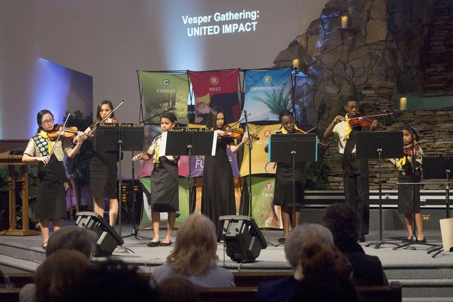 The Umatilla Seventh-Day Adventist youth orchestra presented several pieces at The Gathering worship service on Jan. 28. More than 300 people attended the program that was held at the Mount Dora Seventh-Day Adventist Church. Cindy Dian / Correspondent