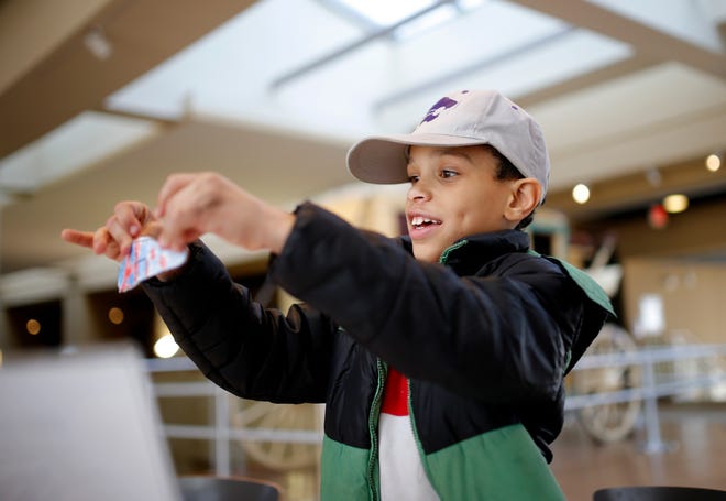 Keonte Adams, 8, makes a plane during the Oklahoma History Center's Hands-On History program for Black History Month, Valentine's Day and Presidents Day. [Photo by Bryan Terry, The Oklahoman]