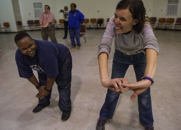 Friends Joseph Lucas, left, and Raegin Nunnery do a move together during an adaptive Zumba class at Dorothy Gilmore Therapeutic Recreation Center.