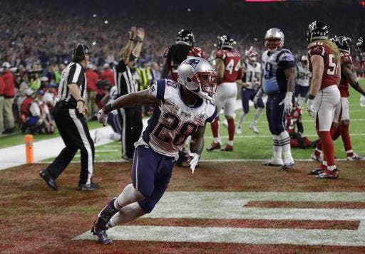 New England Patriots running back James White celebrates after scoring the winning touchdown during overtime of the NFL Super Bowl 51 football game against the Atlanta Falcons on Sunday, Feb. 5, 2017, in Houston.